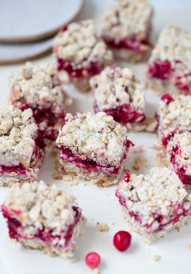 close up of a cranberry oatmeal bars on parchment paper