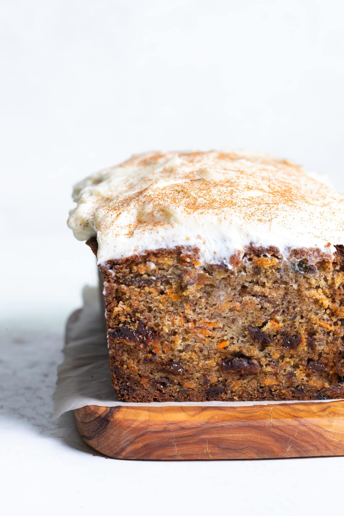 carrot cake bread with cream cheese frosting on top