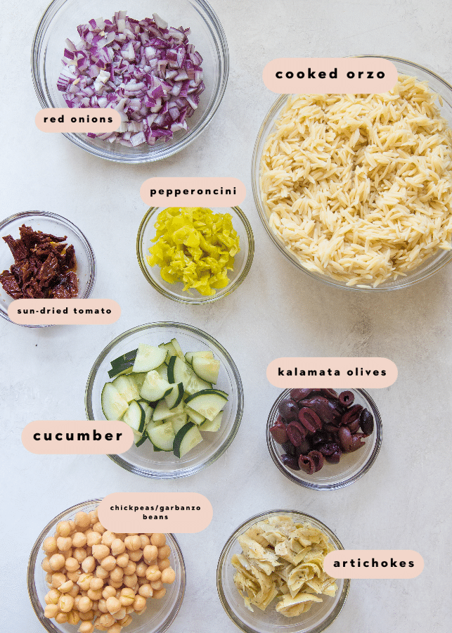 ingredients needed to make orzo salad in glass bowls