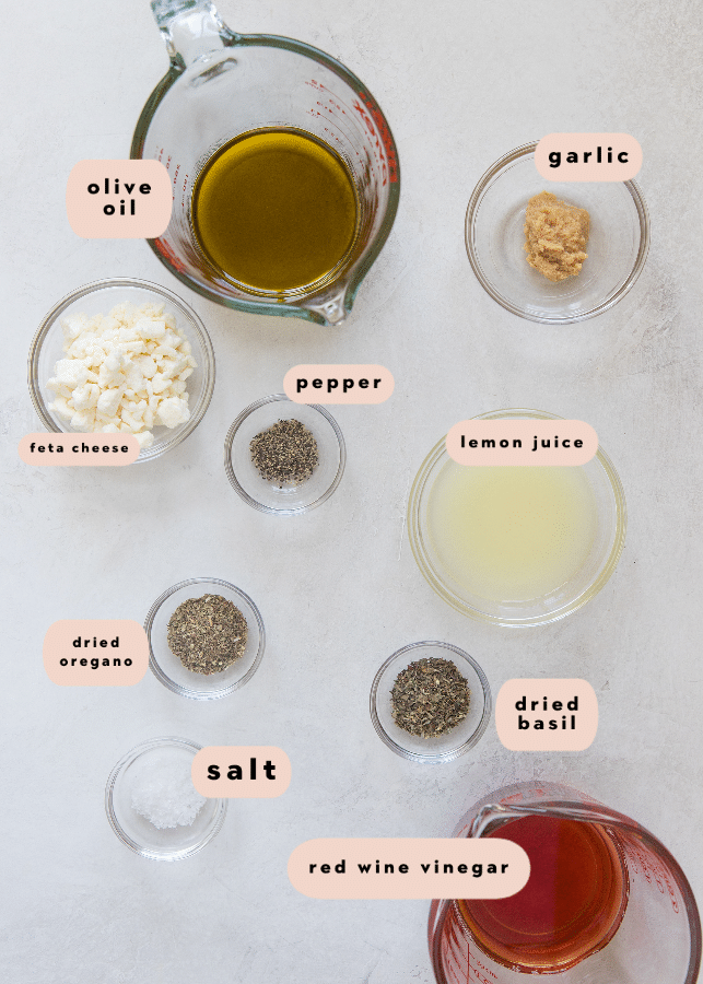 ingredients needed to make greek dressing in glass bowls
