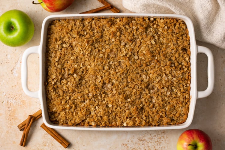 baking dish with apple pie bars layer