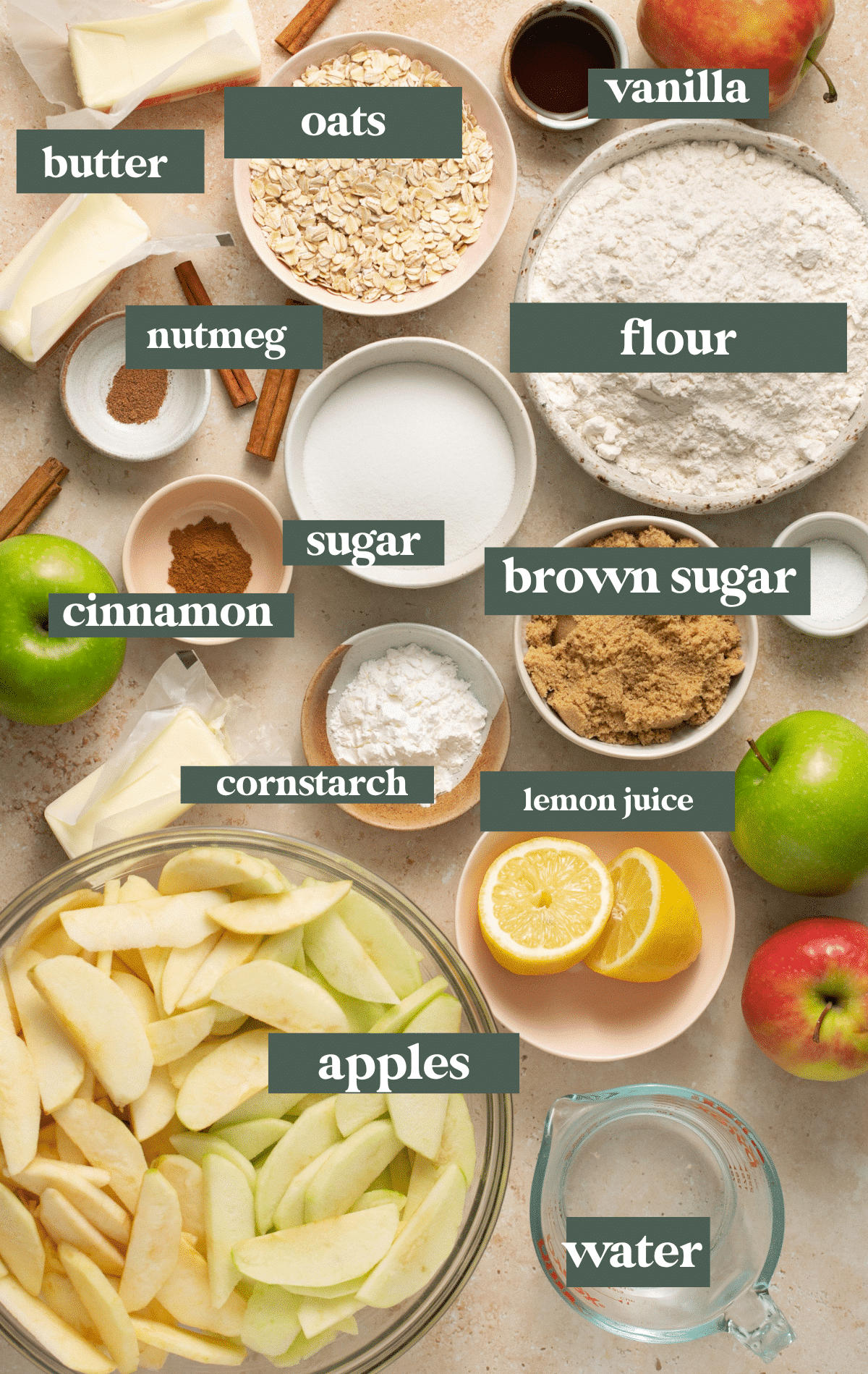 Ingredients in small glass bowls needed to make apple pie bars. 