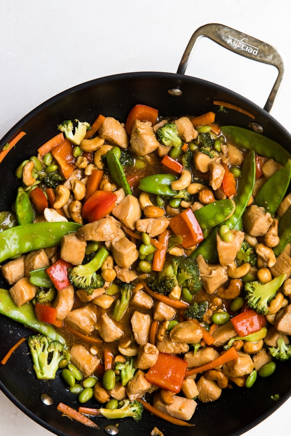 cashew chicken stir fry in a wok