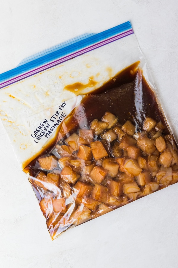 cashew chicken marinating in a plastic baggie