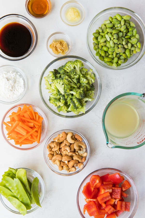 cashew chicken stir fry ingredients in small glass bowls