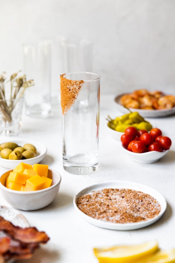 a highball glass with bloody mart rim salt.