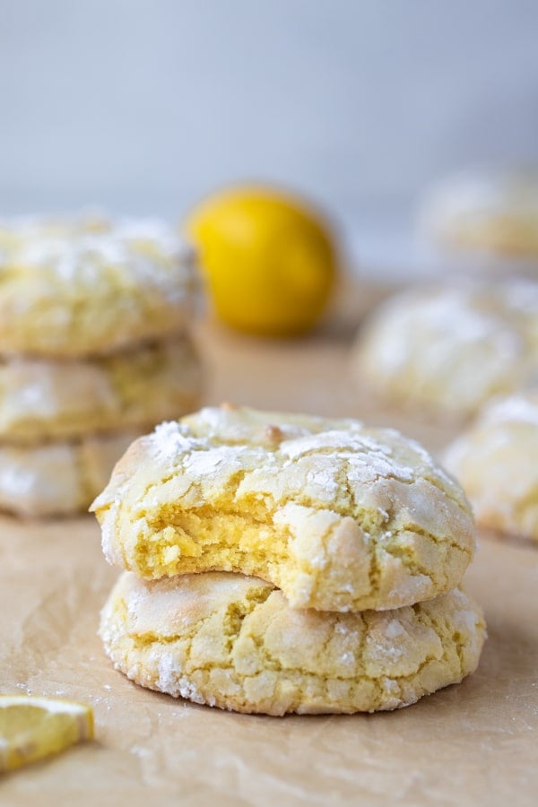 lemon crinkle cookies on parchment paper