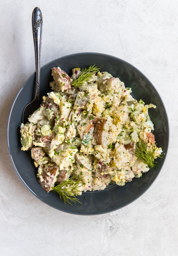 healthy potato salad in a blue dish