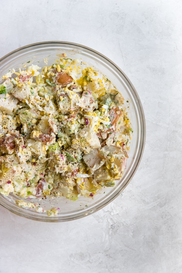 healthy potato salad in a glass bowl