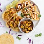 shrimp tacos on a white plate