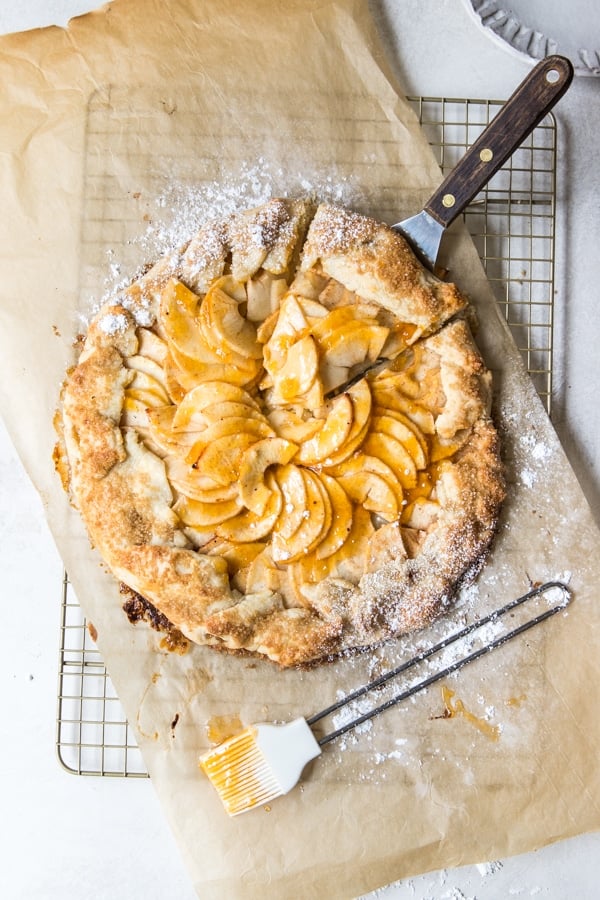 an apple galette on a cooling rack