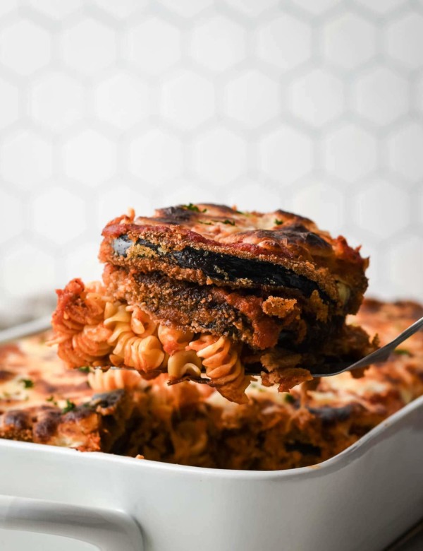 a serving of eggplant parmesan with pasta