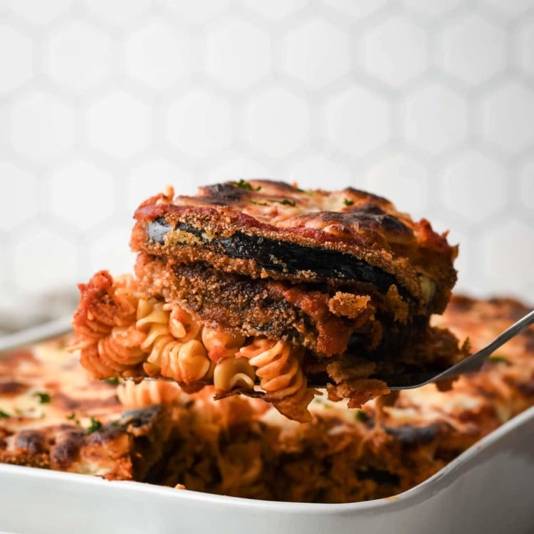 a serving of eggplant parmesan with pasta