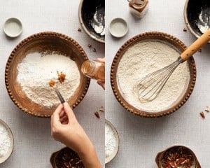 Adding ground cinnamon to a bowl of flour and dry ingredients for maple scones, then whisking everything together in a wooden mixing bowl.