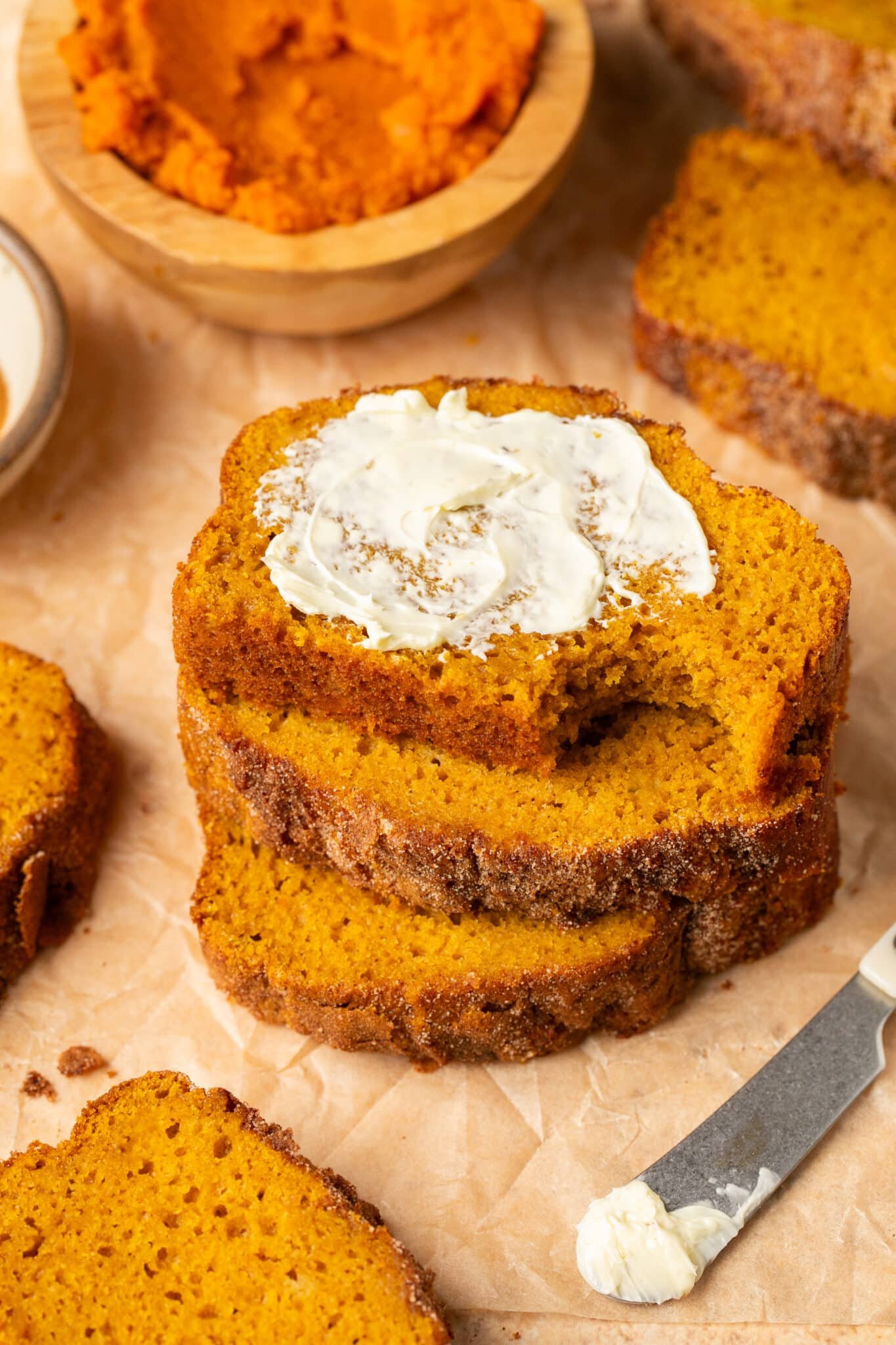 pumpkin bread with butter spread on top. 