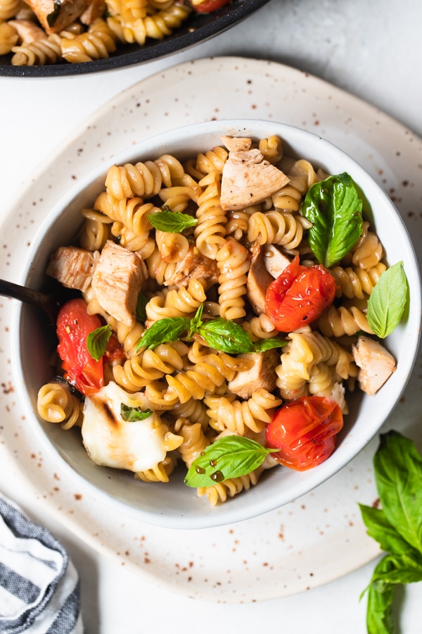 Caprese Pasta in a white bowl