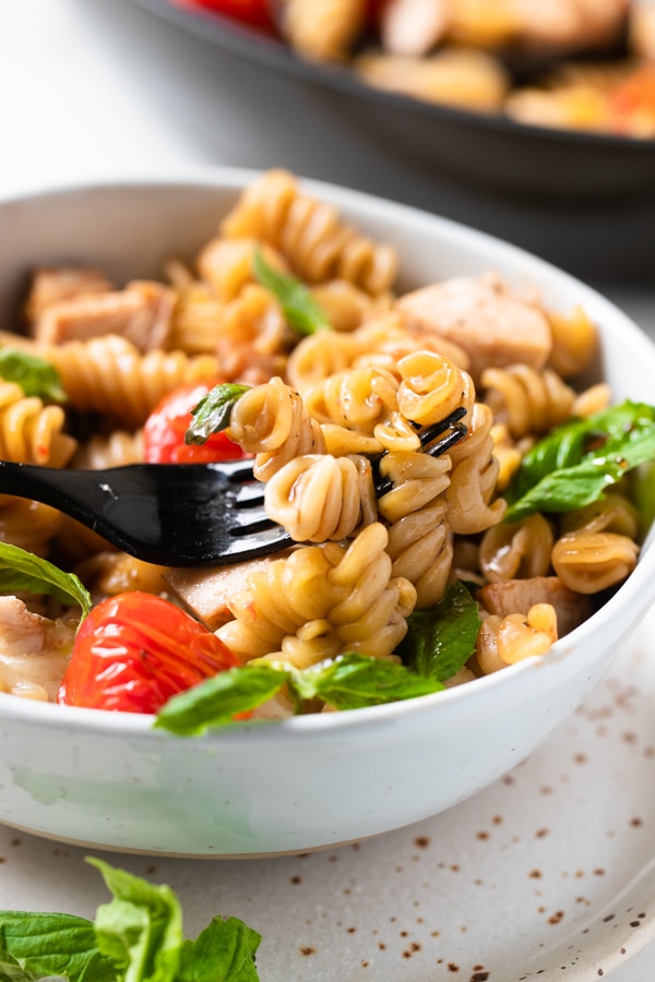 Caprese Pasta in a white bowl