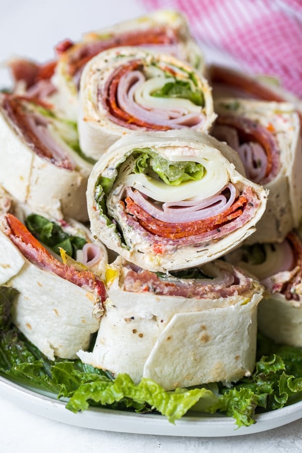 italian pinwheel sandwiches on a white plate