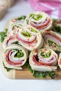 italian pinwheel sandwiches on a cutting board