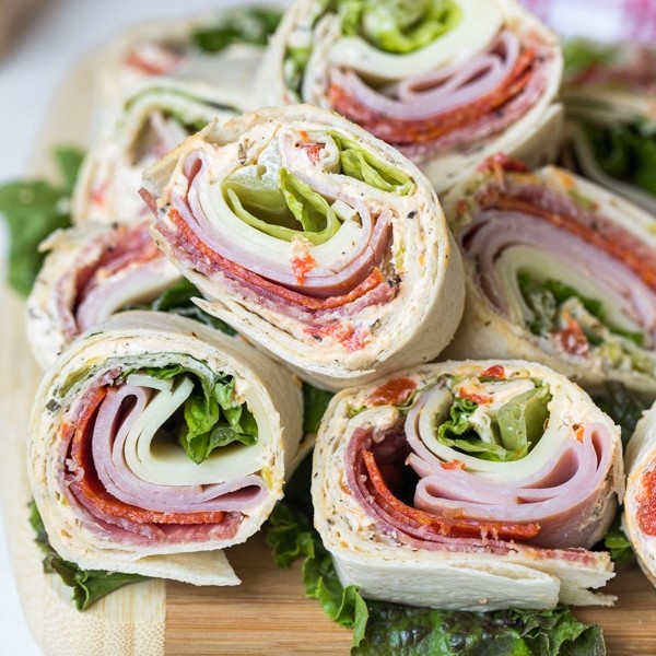 italian pinwheel sandwiches on a cutting board