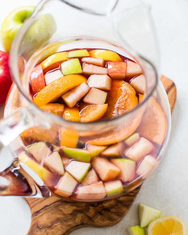 fall sangria in a glass pitcher