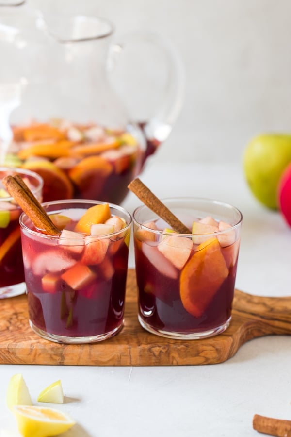 Fall sangria in glasses with a cinnamon stick