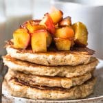 pancakes on a plate with apples on top