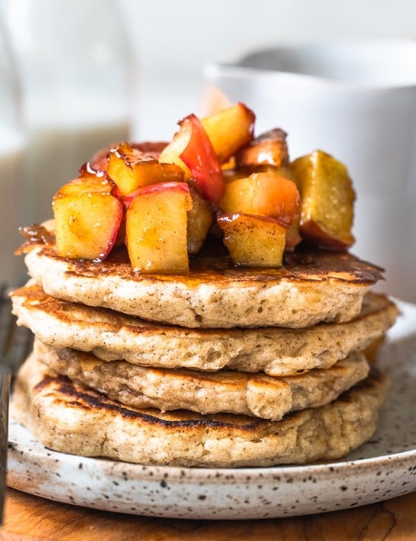 pancakes on a plate with apples on top