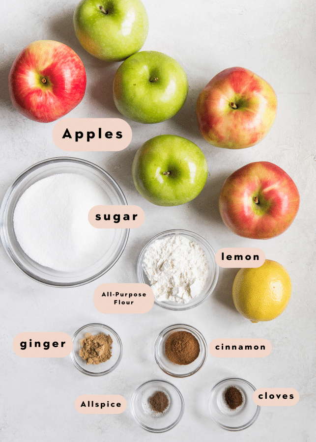 ingredients for apple pie filling in small glass bowls 