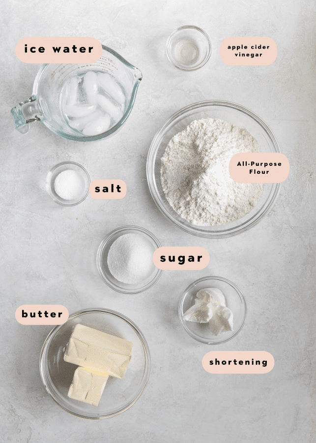 ingredients to make pie crust in small glass bowls