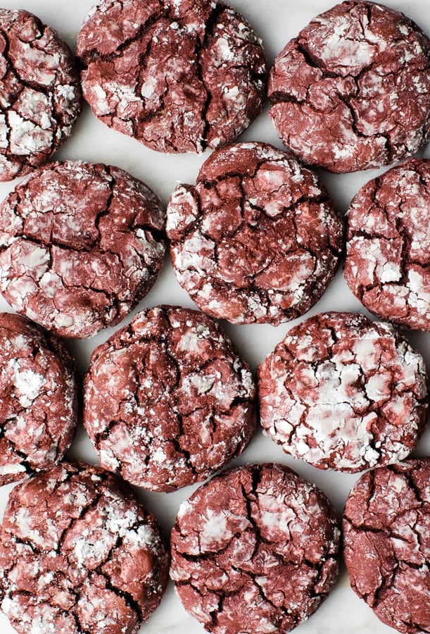 red velvet crinkle cookies on a marble board