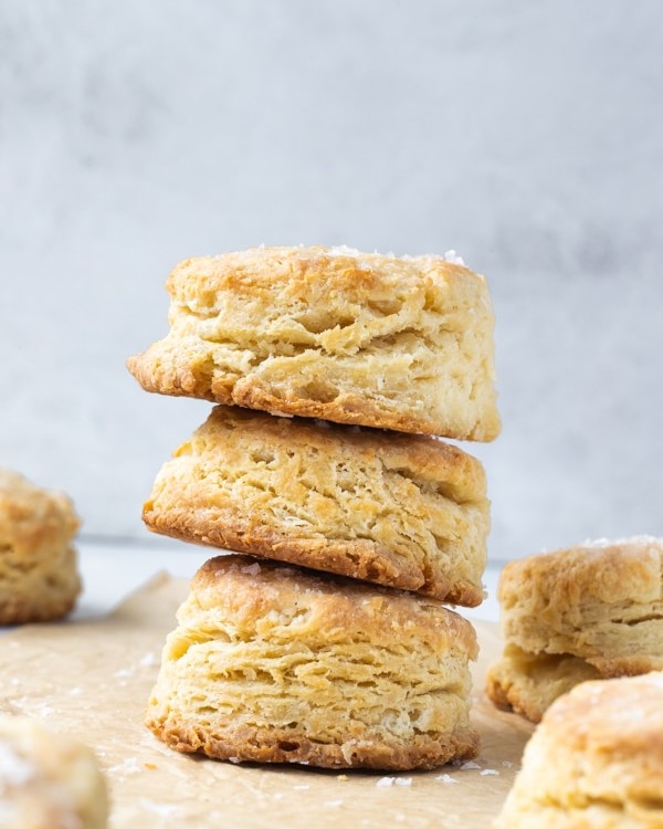 a stack of biscuits on parchment paper