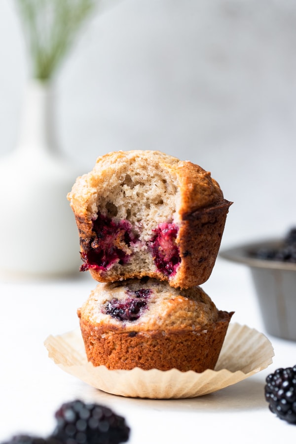blackberry muffins stacked on top of each other