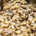 macaroni noodles in a large pot with ground beef