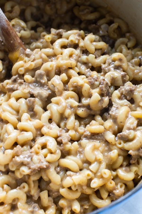 macaroni noodles in a large pot with ground beef