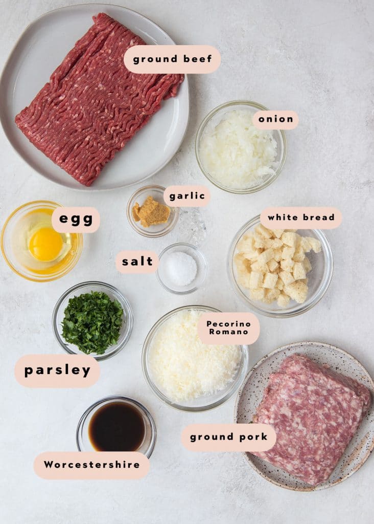 ingredients in small glass bowls needed to make meatballs 