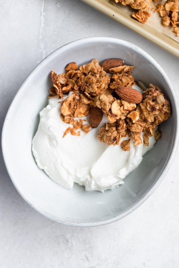 granola and yogurt in a white bowl