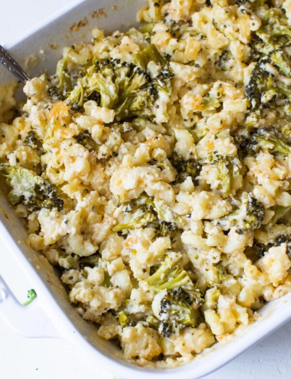 macaroni and cheese with broccoli in a white casserole dish