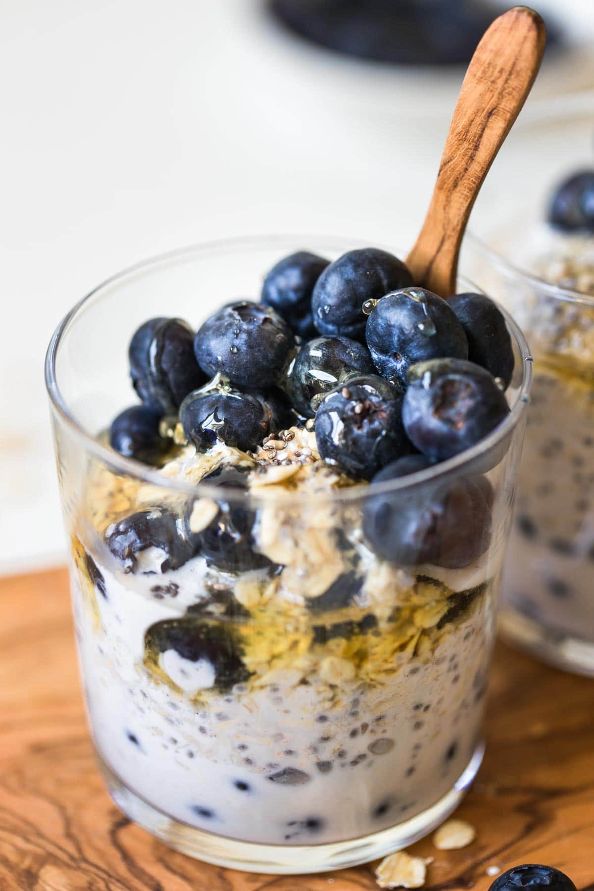 overnight oats in a jar with berries on top