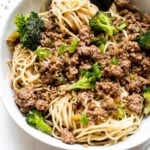 ground beef over noodles in a white bowl