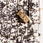 banana bars on parchment paper covered in mini chocolate chips