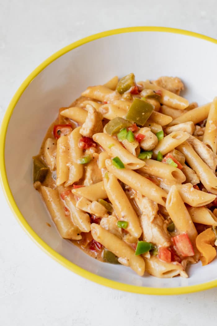 chicken fajita pasta in a white bowl
