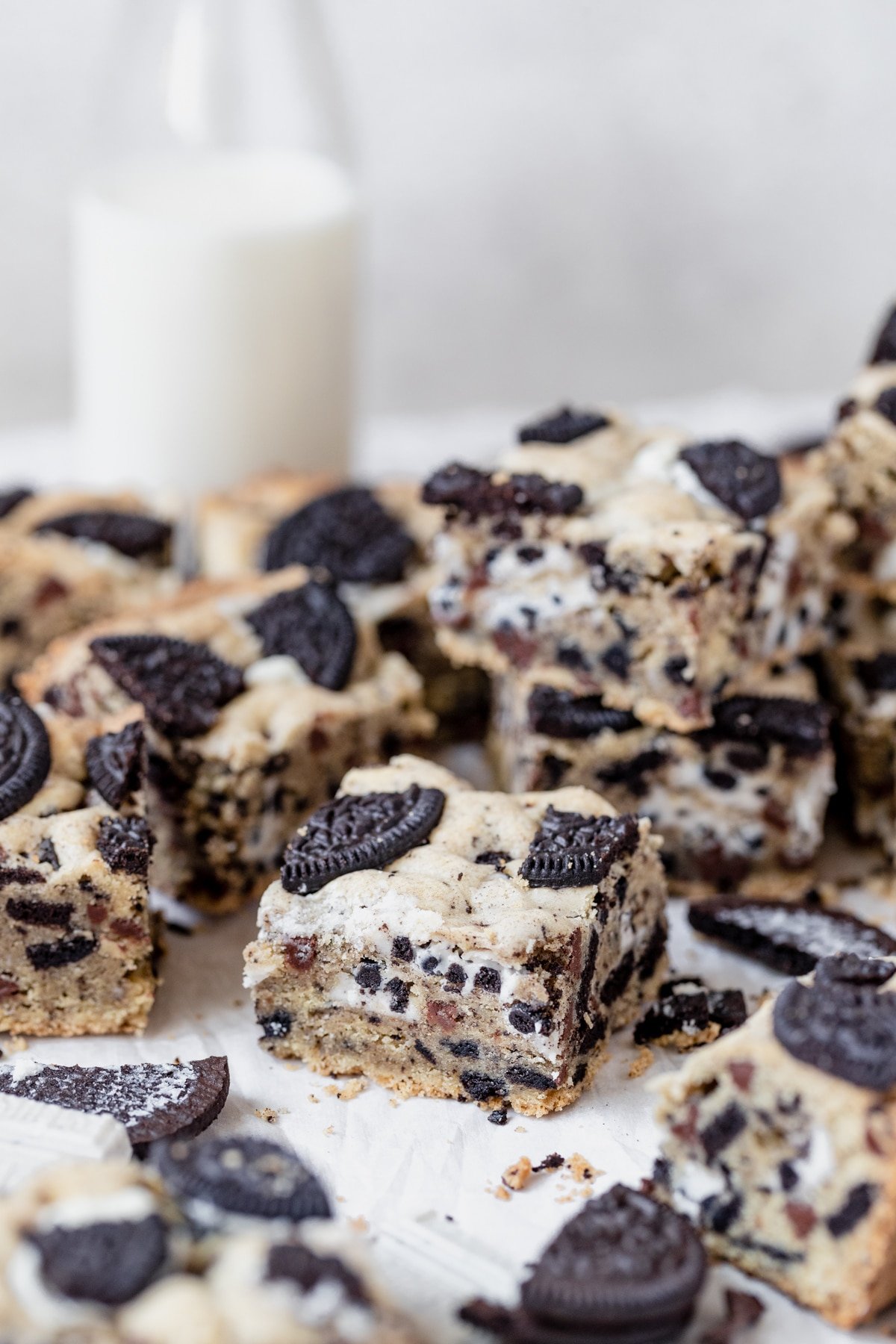 freshly baked cookies and cream bars on parchment paper
