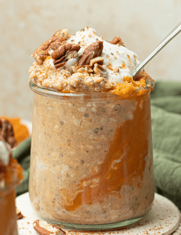 pumpkin overnight oats in glass jar with soon