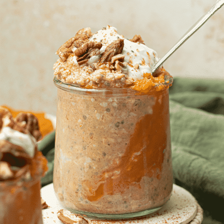 pumpkin overnight oats in glass jar with soon