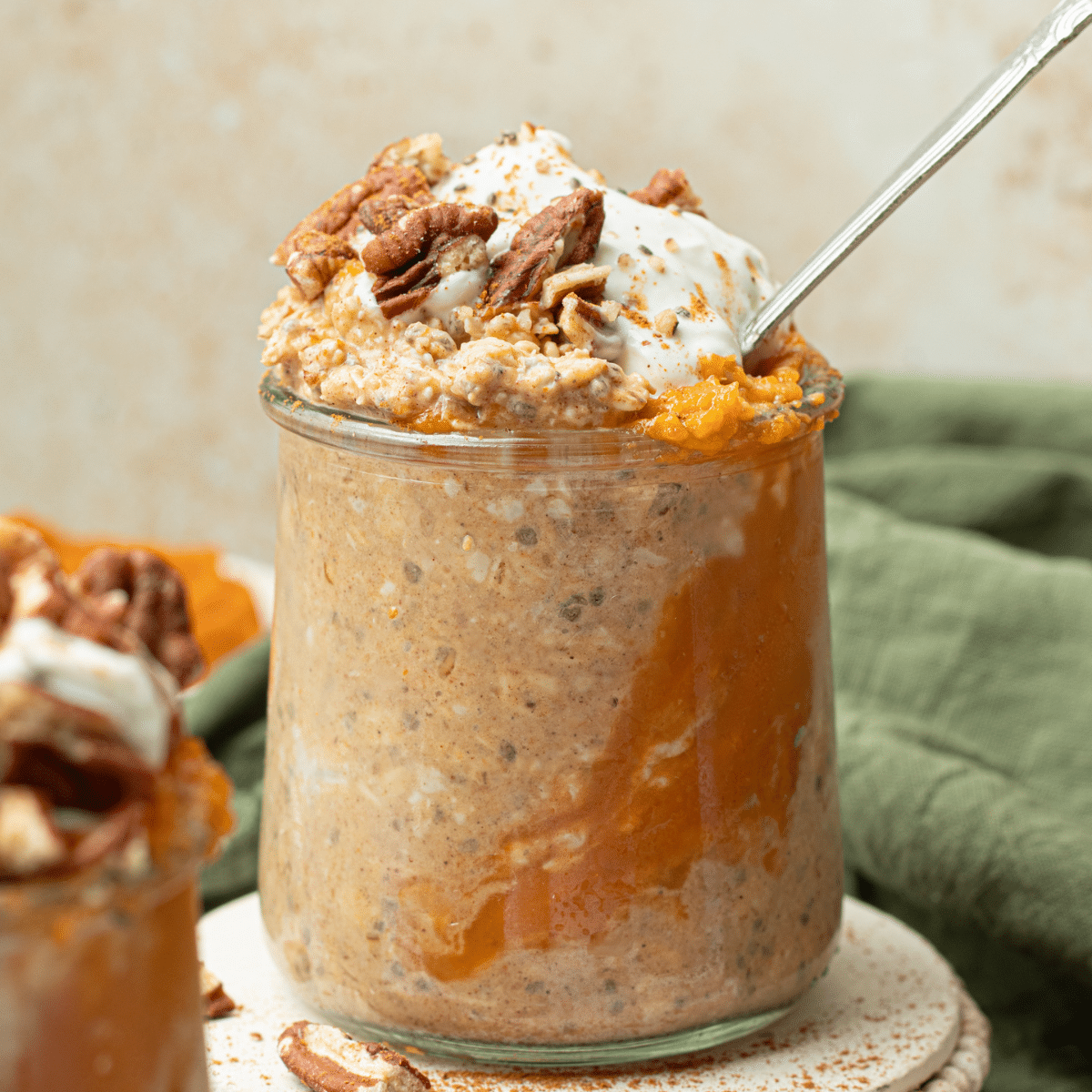 pumpkin overnight oats in glass jar with soon