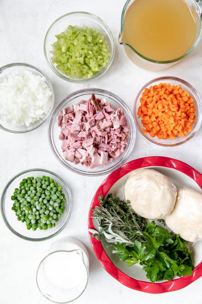 ingredients to make a pot pie in glass bowls