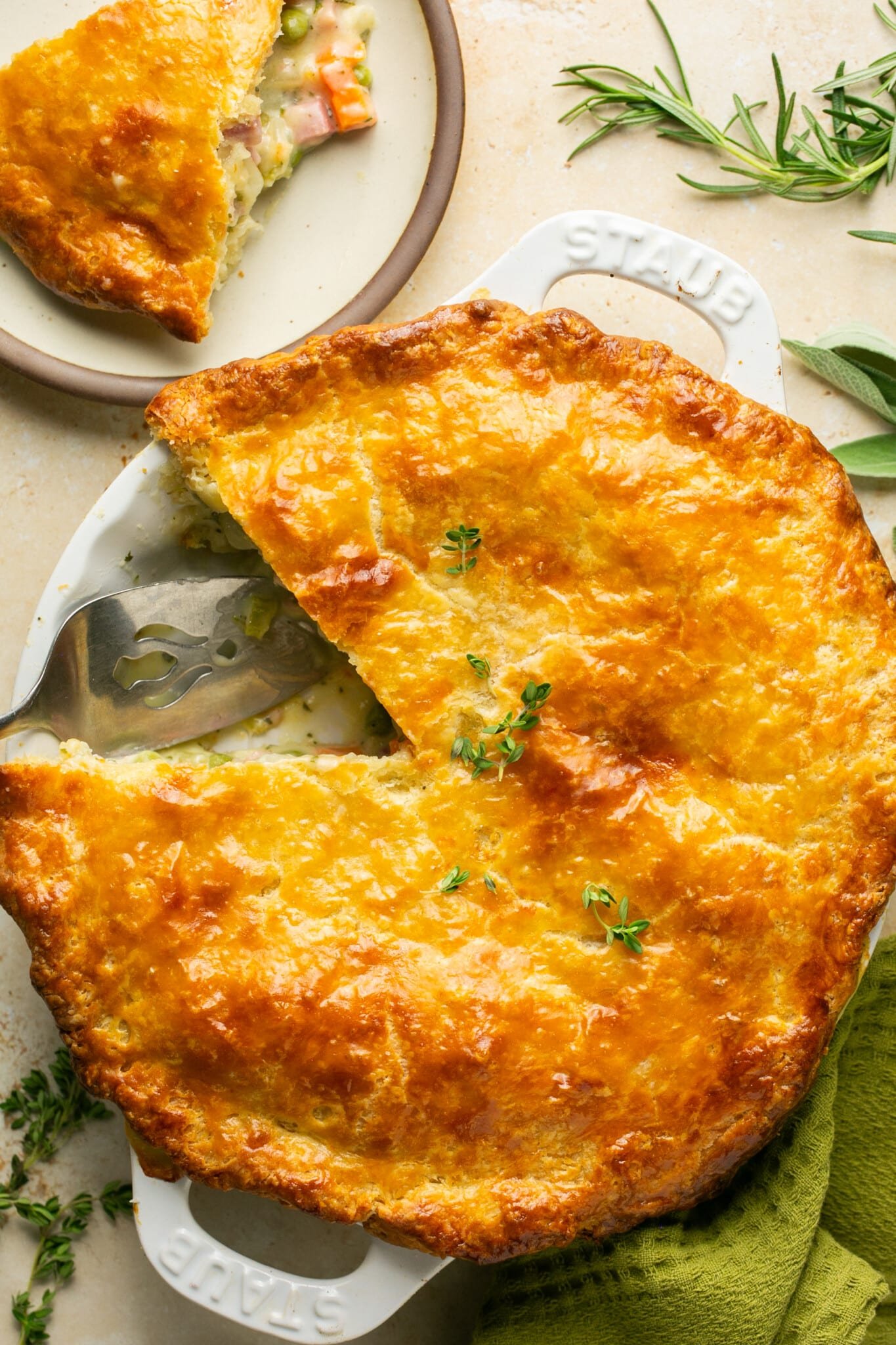 overhead shot of ham pot pie with one piece missing