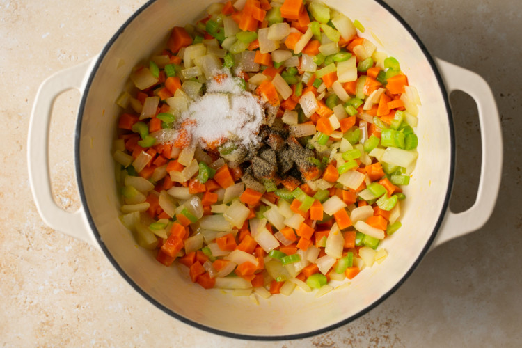 chopped veggies topped with spices in a bowl