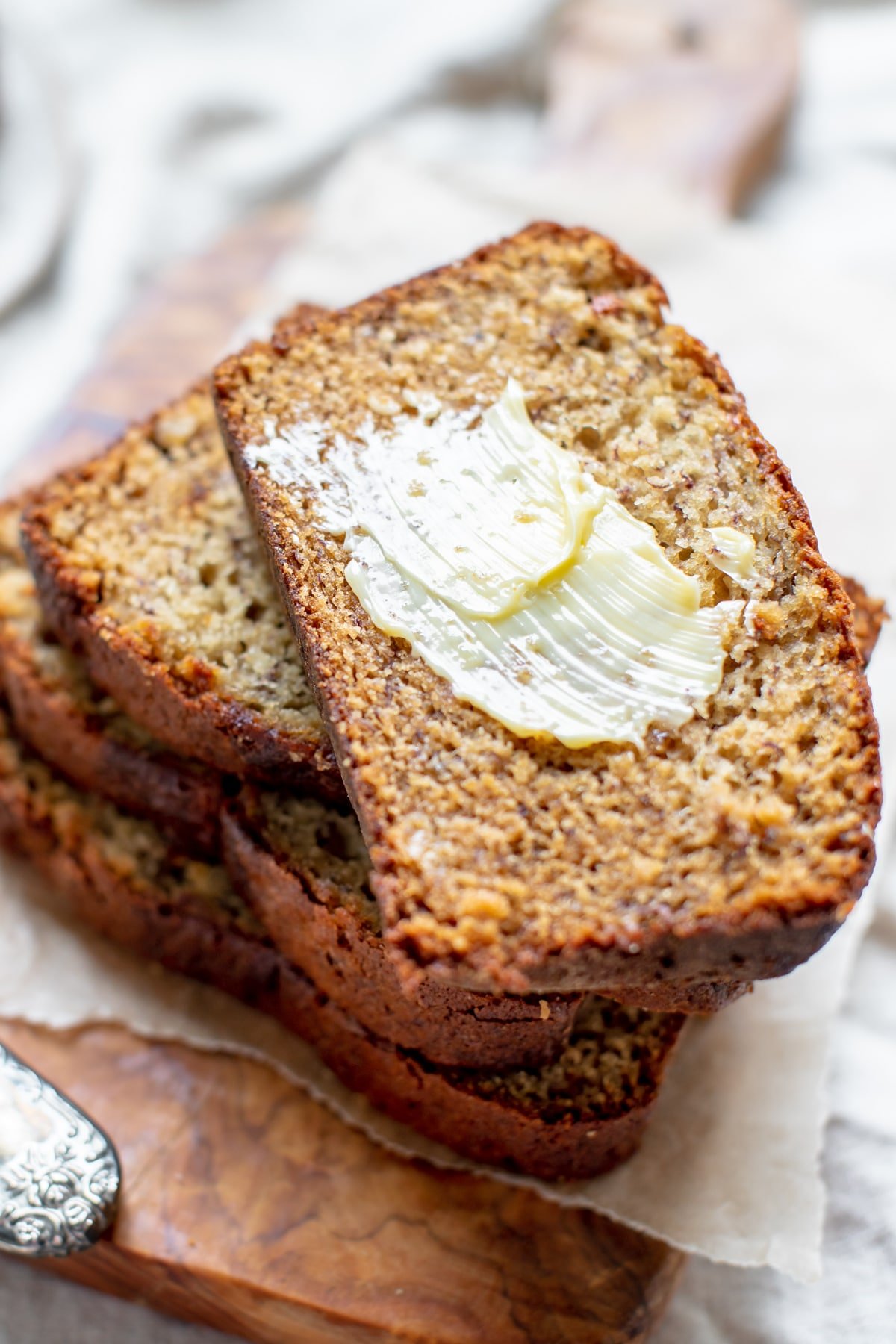 a stack of banana bread with butter smeared on top